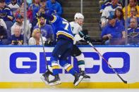 May 21, 2019; St. Louis, MO, USA; St. Louis Blues center Oskar Sundqvist (70) checks San Jose Sharks center Dylan Gambrell (7) during the third period in game six of the Western Conference Final of the 2019 Stanley Cup Playoffs at Enterprise Center. The St. Louis Blues won 5-1. Mandatory Credit: Jeff Curry-USA TODAY Sports