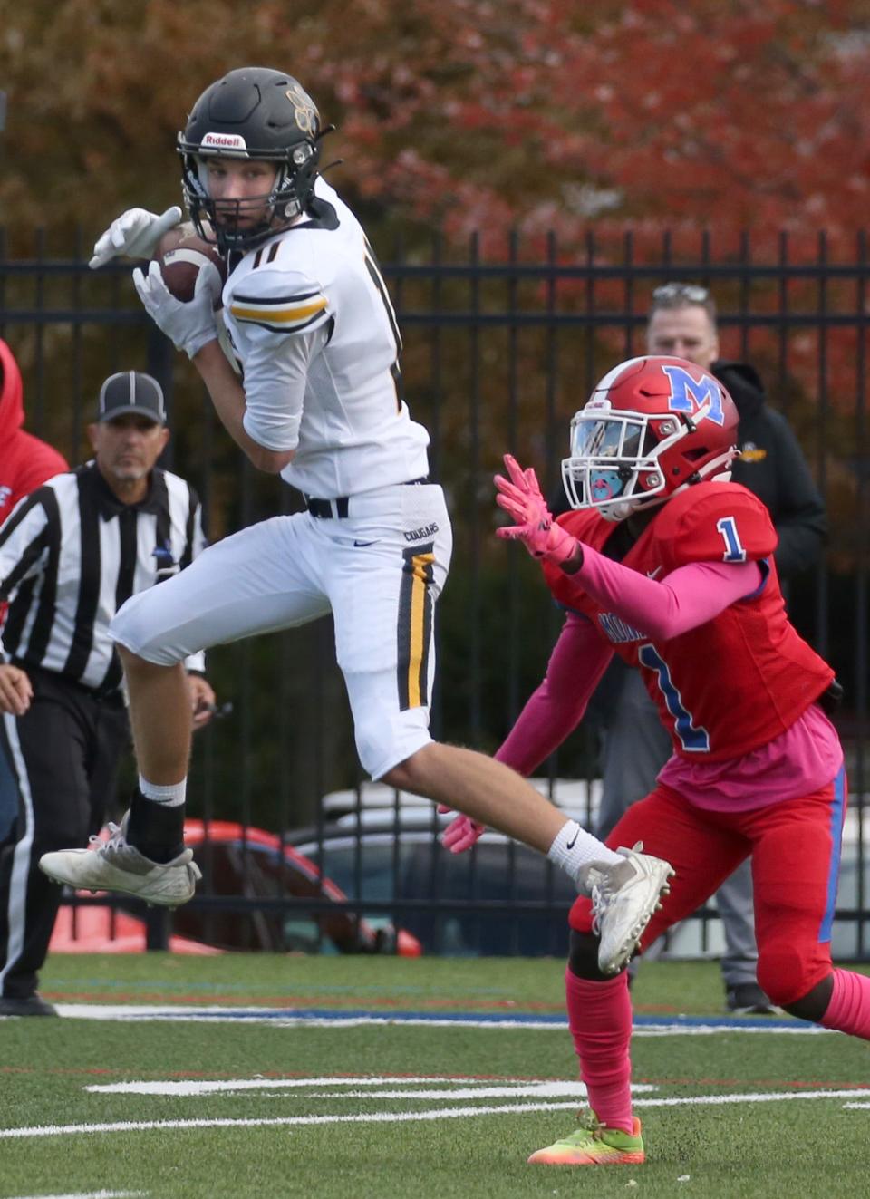 Honeoye Falls-Lima wide receiver Andrew Wanzenried (11) goes up for the reception over Monroe defensive back Styhles McKenzie-Baker (1) in the first half during their game Saturday, Oct. 8, 2022 at James Monroe High School in Rochester. 