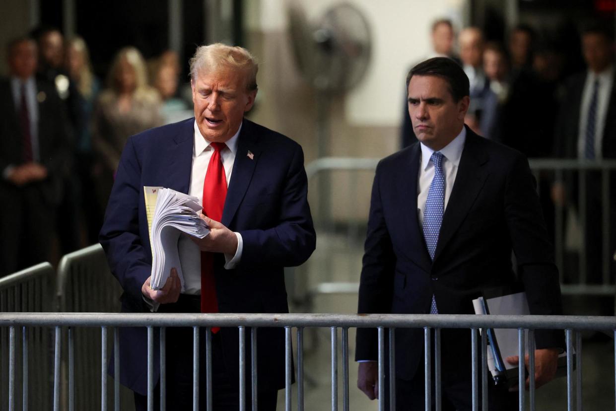 <span>Donald Trump leaves court in New York on Tuesday.</span><span>Photograph: Yuki Iwamura/Reuters</span>