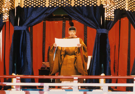 FILE PHOTO: Emperor Akihito pledges to observe the Constitution of Japan during the ceremonies marking his accession to Japan's Chrysanthemum Throne on November 12, 1990. Imperial Household Agency of Japan/Handout via Reuters/File Photo