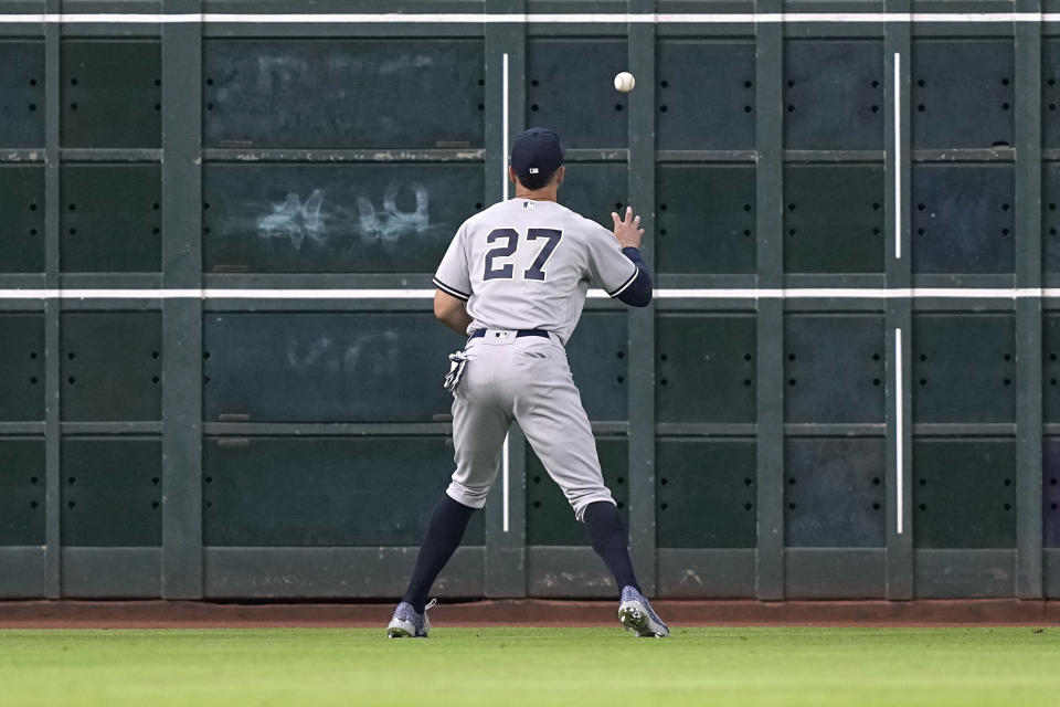 New York Yankees left fielder Giancarlo Stanton plays a two-run double by Houston Astros' Alex Bregman off the wall during the third inning of a baseball game Thursday, June 30, 2022, in Houston. (AP Photo/David J. Phillip)