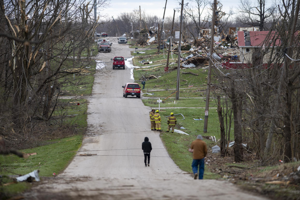 Damage from a late-night tornado is seen in Sullivan, Ind., Saturday, April 1, 2023. Multiple deaths were reported in the area following the storm. (AP Photo/Doug McSchooler)