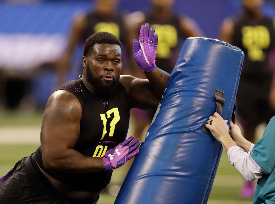 South Florida defensive lineman Deadrin Senat runs a drill during the NFL football scouting combine, Sunday, March 4, 2018, in Indianapolis. (AP Photo/Darron Cummings)