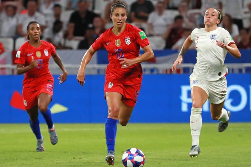 Carli Lloyd (C) totaled the fifth-most assists (64) in the history of the United States Women's National Team. File Photo by David Silpa/UPI