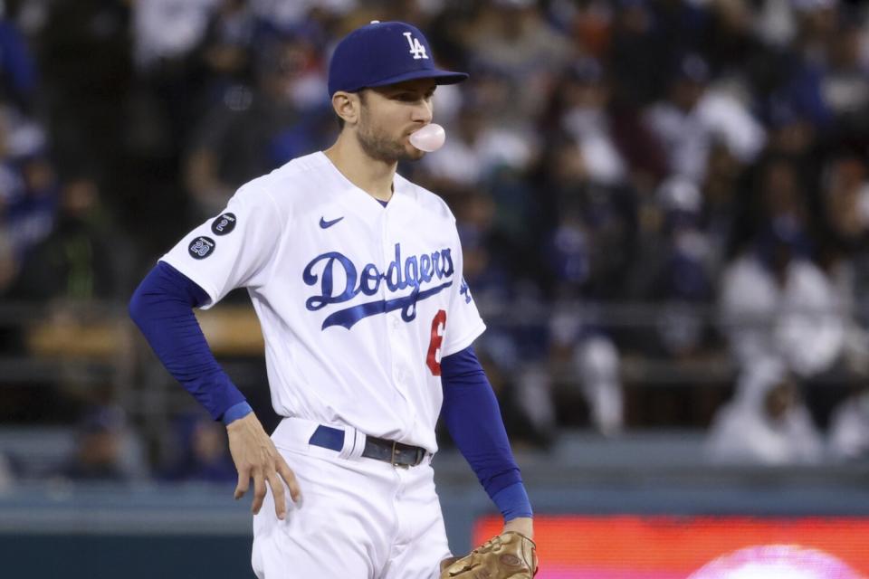 Dodgers second baseman Trea Turner blows a bubble while waiting for a pitch.