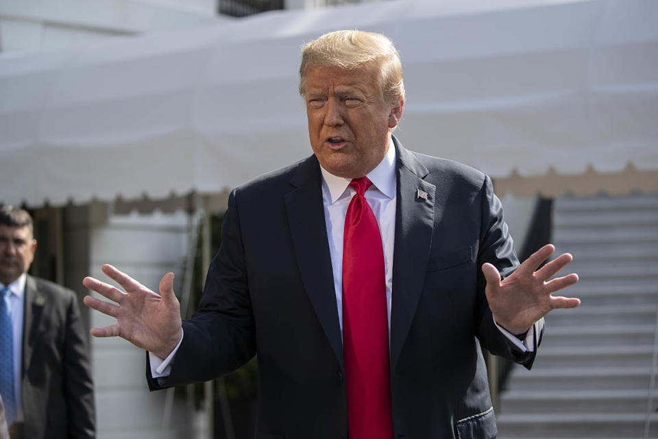 President Donald Trump speaks with reporters before departing on Marine One on the South Lawn of the White House, Tuesday, June 23, 2020, in Washington. (AP Photo/Alex Brandon)