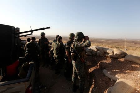 Kurdish Peshmerga forces keep watch in a village east of Mosul, Iraq, May 29, 2016. REUTERS/Azad Lashkari