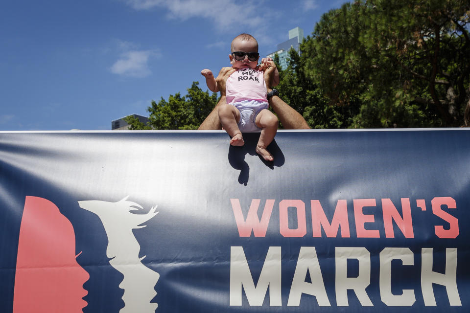 An infant is held up at a demonstration against new U.S. President Donald Trump on January 21, 2017 in Sydney, Australia.&nbsp;