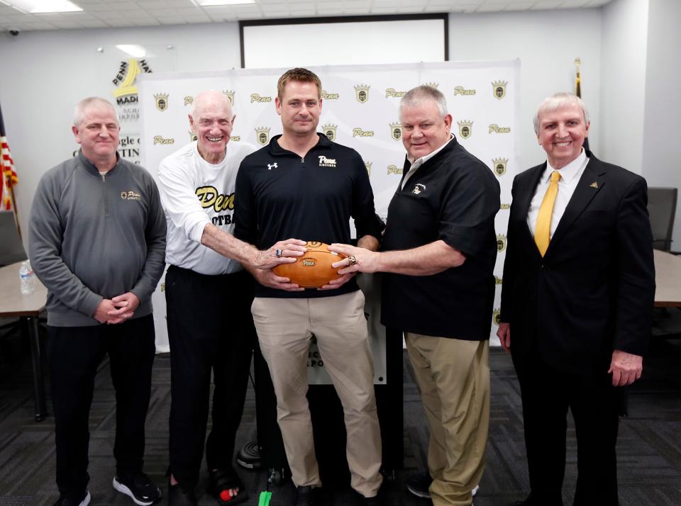 Pictured, from left, are Penn Athletic Director Jeff Hart, Chris Geesman, Pete Riordan, Cory Yeoman and PHM Superintendent Jerry Thacker at a press conference introducing Riordan as the new head football coach Wednesday, March 20, 2024, at Penn High School in Mishawaka.