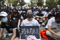 Students gather during a school children's strike event in support of protest movement in Hong Kong Monday, Sept. 30, 2019. Hong Kong authorities Monday rejected an appeal for a major pro-democracy march on National Day’s holiday after two straight days of violent clashes between protesters and police in the semi-autonomous Chinese territory roused fears of more showdowns that would embarrass Beijing. The sign reads " See you in the Legislative council in the future, students are not rioters. " (AP Photo/Gemunu Amarasinghe)