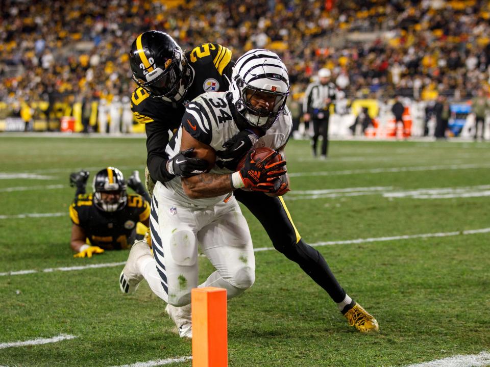 Samaje Perine dives for the pylon against the Pittsburgh Steelers.