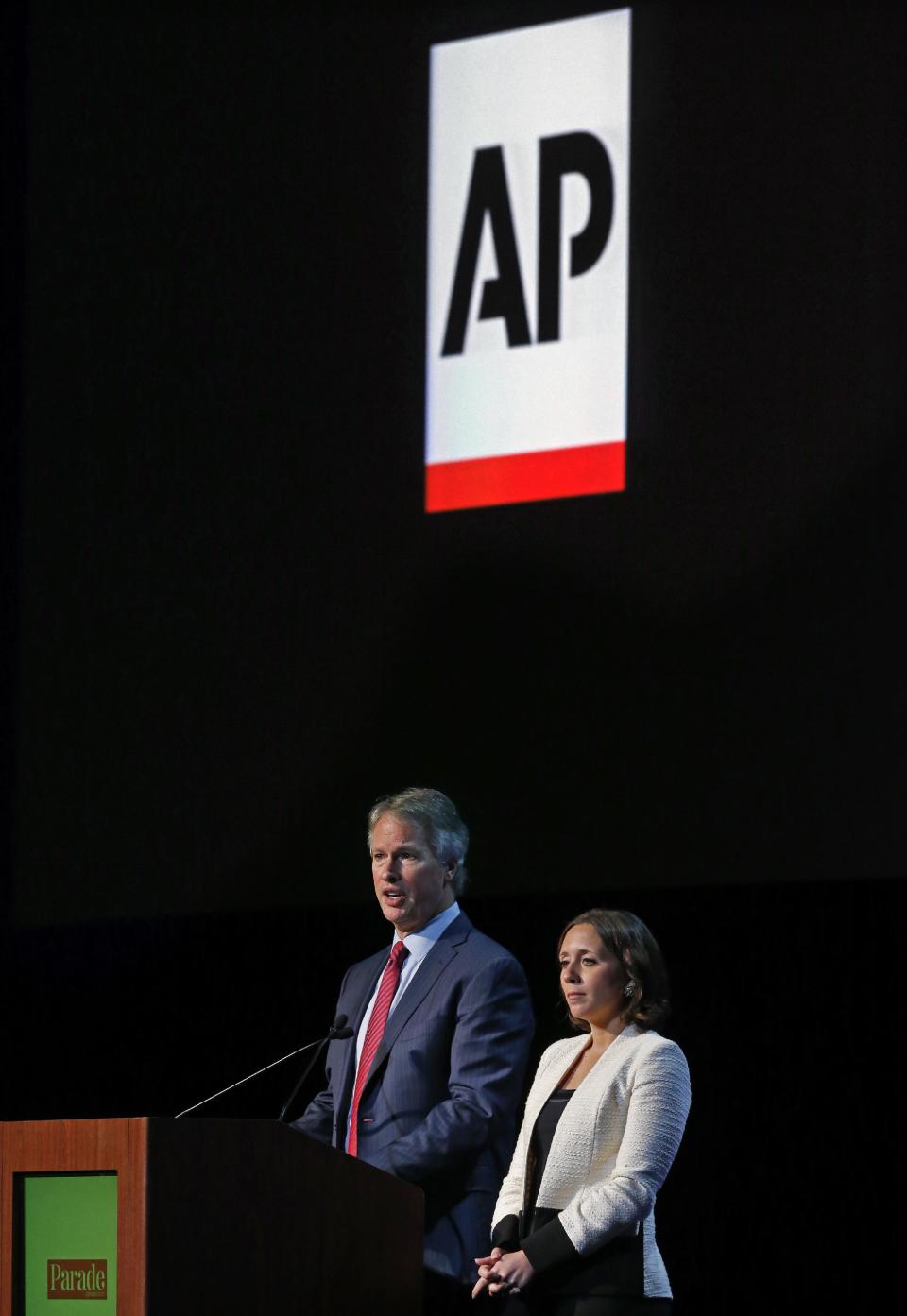 Gary Pruitt, left, president and CEO of The Associated Press, and Julie Pace, AP's chief White House correspondent, take questions after speaking to editors and publishers at the Newspaper Association of America’s mediaXchange 2014 convention in Denver, Tuesday, March 18, 2014. (AP Photo/Brennan Linsley)