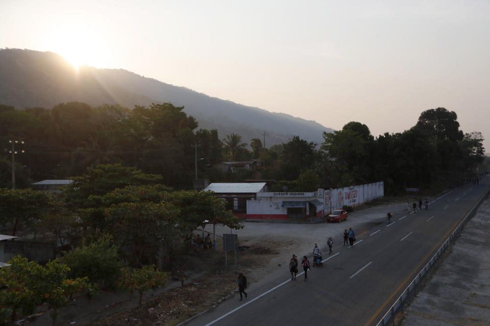 Central American migrants traveling in a caravan to the U.S. border walk on the highway to Pijijiapan, Chiapas State, Mexico, Monday, April 22, 2019. The outpouring of aid that once greeted Central American migrants as they trekked in caravans through southern Mexico has been drying up, so this group is hungrier, advancing slowly or not at all, and hounded by unhelpful local officials. (AP Photo/Moises Castillo)