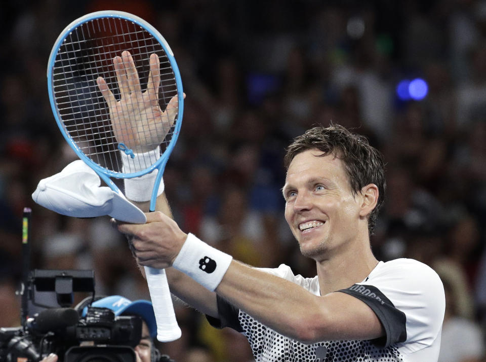 Tomas Berdych of the Czech Republic celebrates after defeating Argentina's Diego Schwartzman during their third round match at the Australian Open tennis championships in Melbourne, Australia, Friday, Jan. 18, 2019. (AP Photo/Aaron Favila)