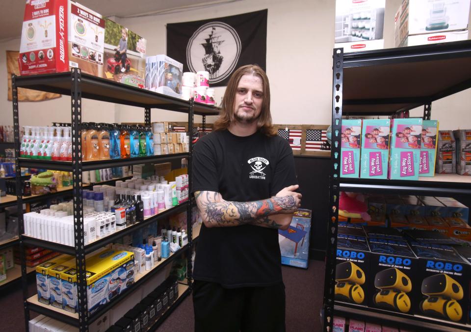 Eric Strata is the owner of Black Sales Liquidation in Alliance. He is shown at his store in June in this file photo.