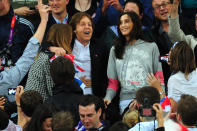 (L-R) Designer Stella McCartney, Paul McCartney and wife Nancy Shevell cheer on the athletes on Day 8 of the London 2012 Olympic Games at Olympic Stadium on August 4, 2012 in London, England. (Photo by Stu Forster/Getty Images)