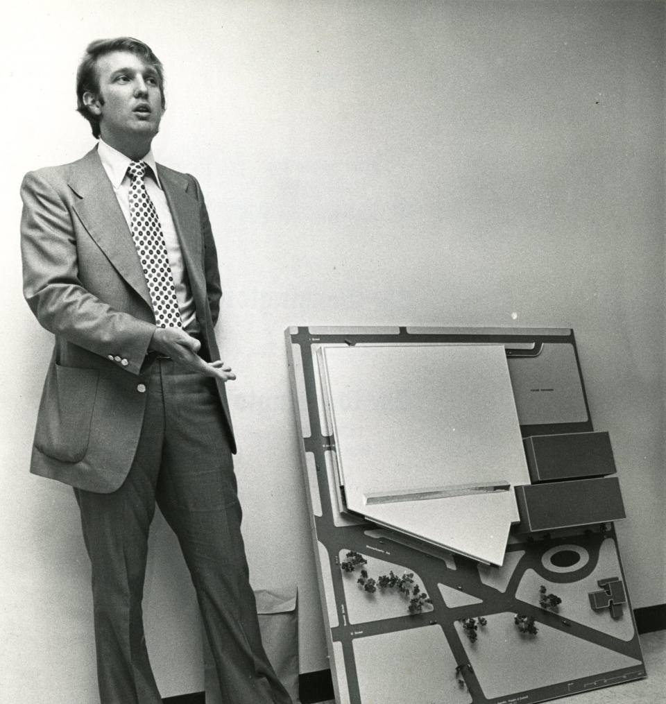 Standing&nbsp;next to a model of the D.C. convention center he had hoped to develop.