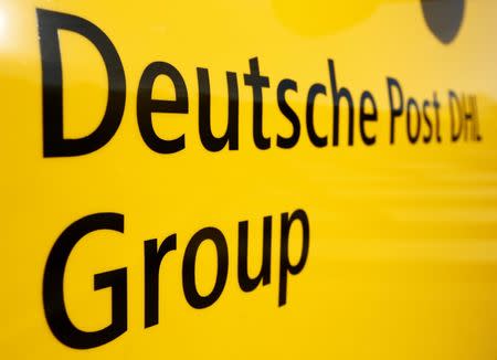 The logo of German postal and logistics group Deutsche Post DHL is seen on the delivery car "Street Scooter" in Aachen, Germany, August 23, 2016. REUTERS/Thilo Schmuelgen/File Photo
