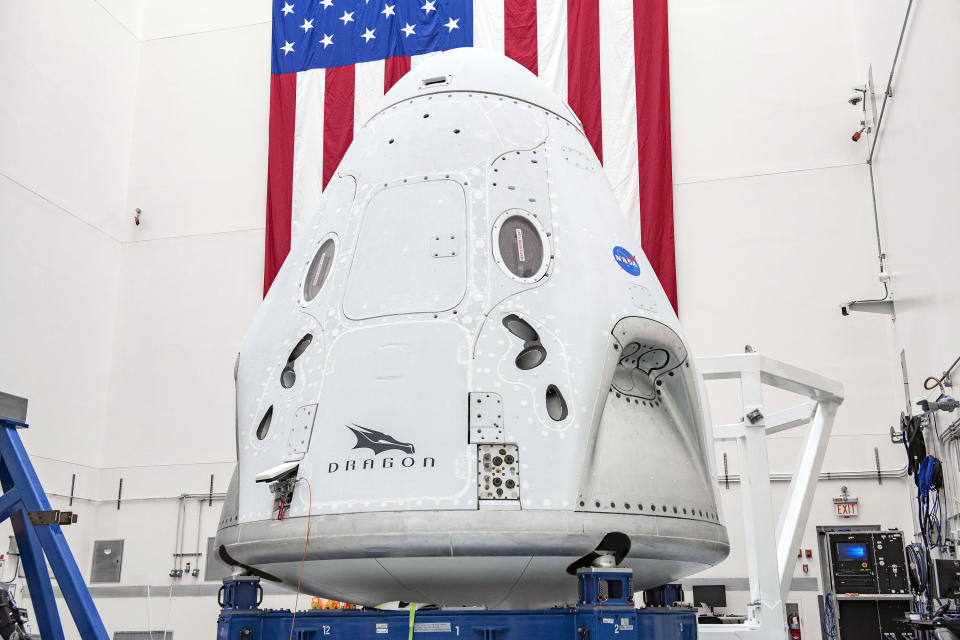 This April 2020 photo made available by SpaceX shows the company's Crew Dragon spacecraft undergoing final processing at Cape Canaveral Air Force Station, Fla,, in preparation for the May 27, 2020, Demo-2 launch with NASA astronauts Bob Behnken and Doug Hurley to the International Space Station for NASA's Commercial Crew Program. (SpaceX via AP)