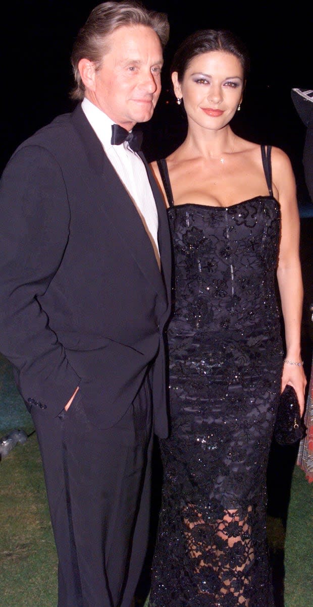 Michael Douglas and Catherine Zeta-Jones at the premiere of "Entrapment" on June 30, 1999<p>Dave Hogan/Hulton Archive via Getty Images</p>