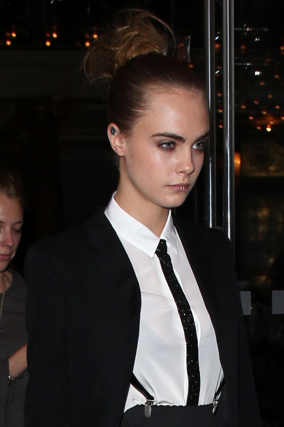 Cara Delevingne was spotted in a menswear-inspired look in London last year. (Photo: Getty Images)