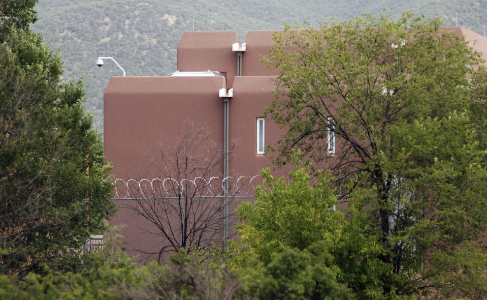 The Taos county jail, where three people accused of child abuse at a desert compound are awaiting release, is shown Wednesday, Aug. 15, 2018, in Taos, N.M. Security was boosted at the judiciary complex amid threats against the state judge who cleared the way for the defendants to leave jail. (AP Photo/Morgan Lee)