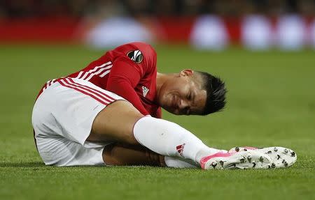 Britain Football Soccer - Manchester United v RSC Anderlecht - UEFA Europa League Quarter Final Second Leg - Old Trafford, Manchester, England - 20/4/17 Manchester United's Marcos Rojo sustains an injury Reuters / Andrew Yates Livepic