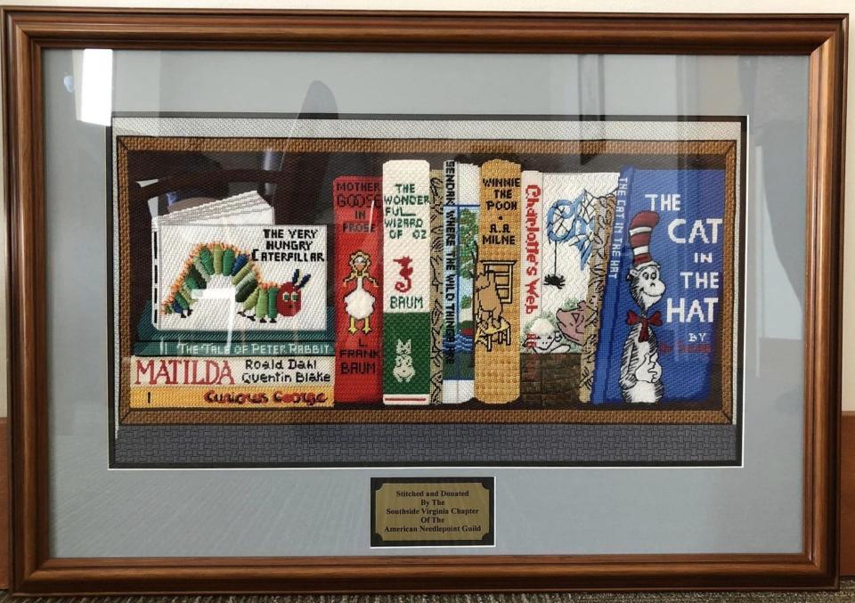 'Children's Classic Books' needlepoint piece stitched, framed and donated in January 2024 to Petersburg Public Library by Southside Virginia Chapter of the American Needlepoint Guild.