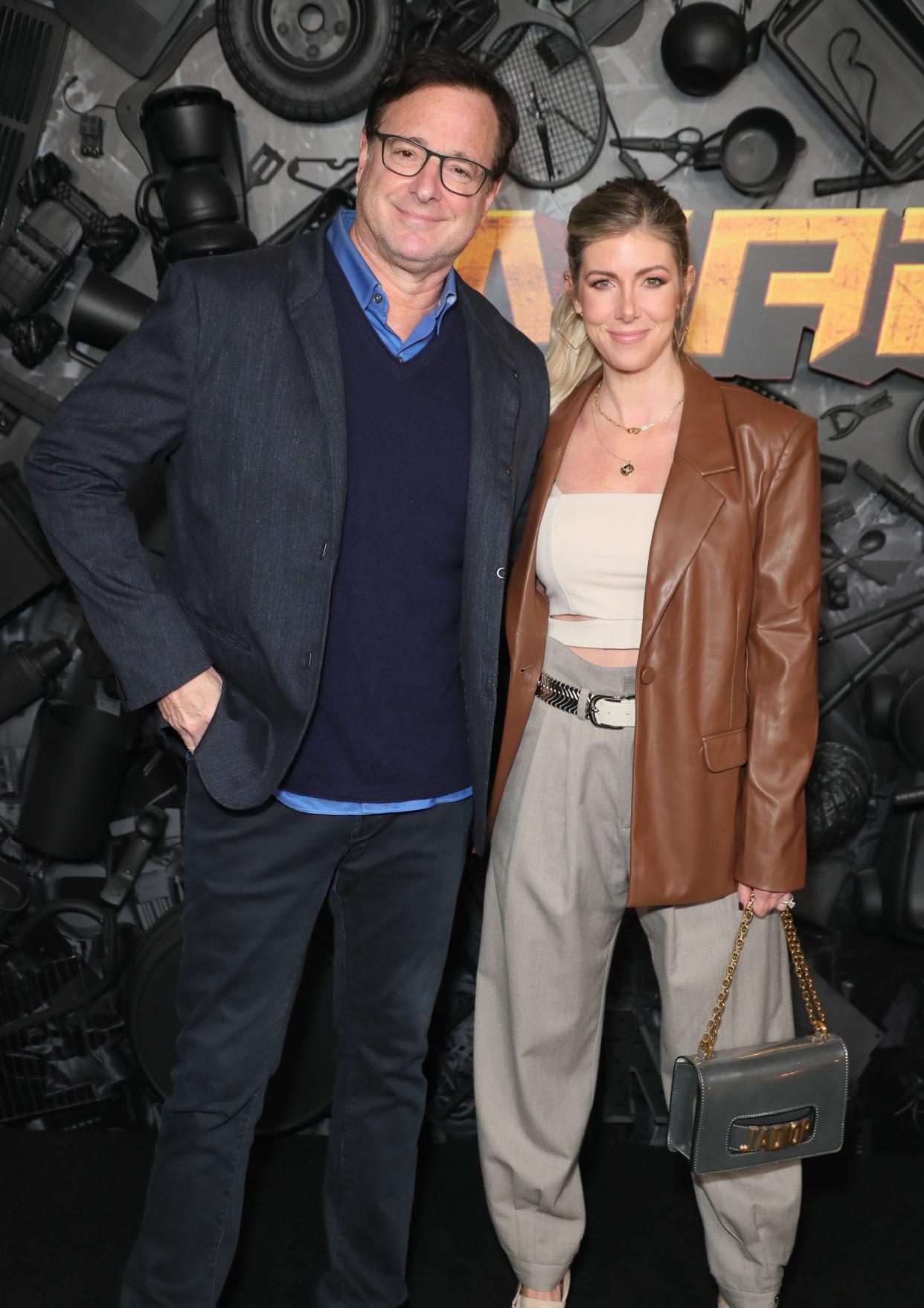 (L-R) Kelly Rizzo and Bob Saget attend the red carpet premiere and party for Peacock's new comedy series "MacGruber" at California Science Center on Dec. 8, 2021, in Los Angeles, Calif.