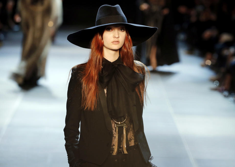 A model wears a creation by French born fashion designer Hedi Slimane for Saint Laurent ready to wear Spring-Summer 2013 collection, presented in Paris, Monday, Oct. 1, 2012. (AP Photo/Jacques Brinon)