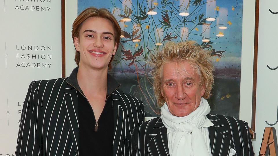 Alastair Stewart standing with father Rod Stewart