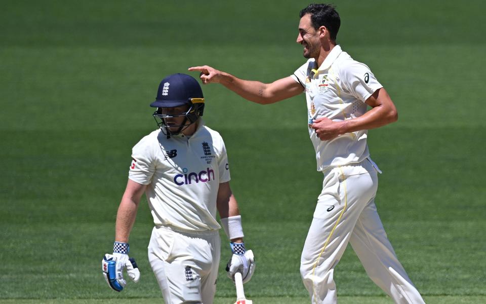 Australian bowler Mitchell Starc reacts after dismissing England batsman Ollie Pope (left) for 4 runs on day 5 of the Second Ashes Test between Australia and England - DAVE HUNT/EPA-EFE/Shutterstock