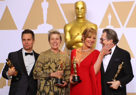 Oscar winners Sam Rockwell, Frances McDormand, Allison Janney and Gary Oldman (L to R) pose backstage. REUTERS/Mike Blake