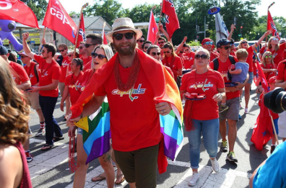 Washington Capitals goaltender Braden Holtby marches in the 2016 Capital Pride Parade.