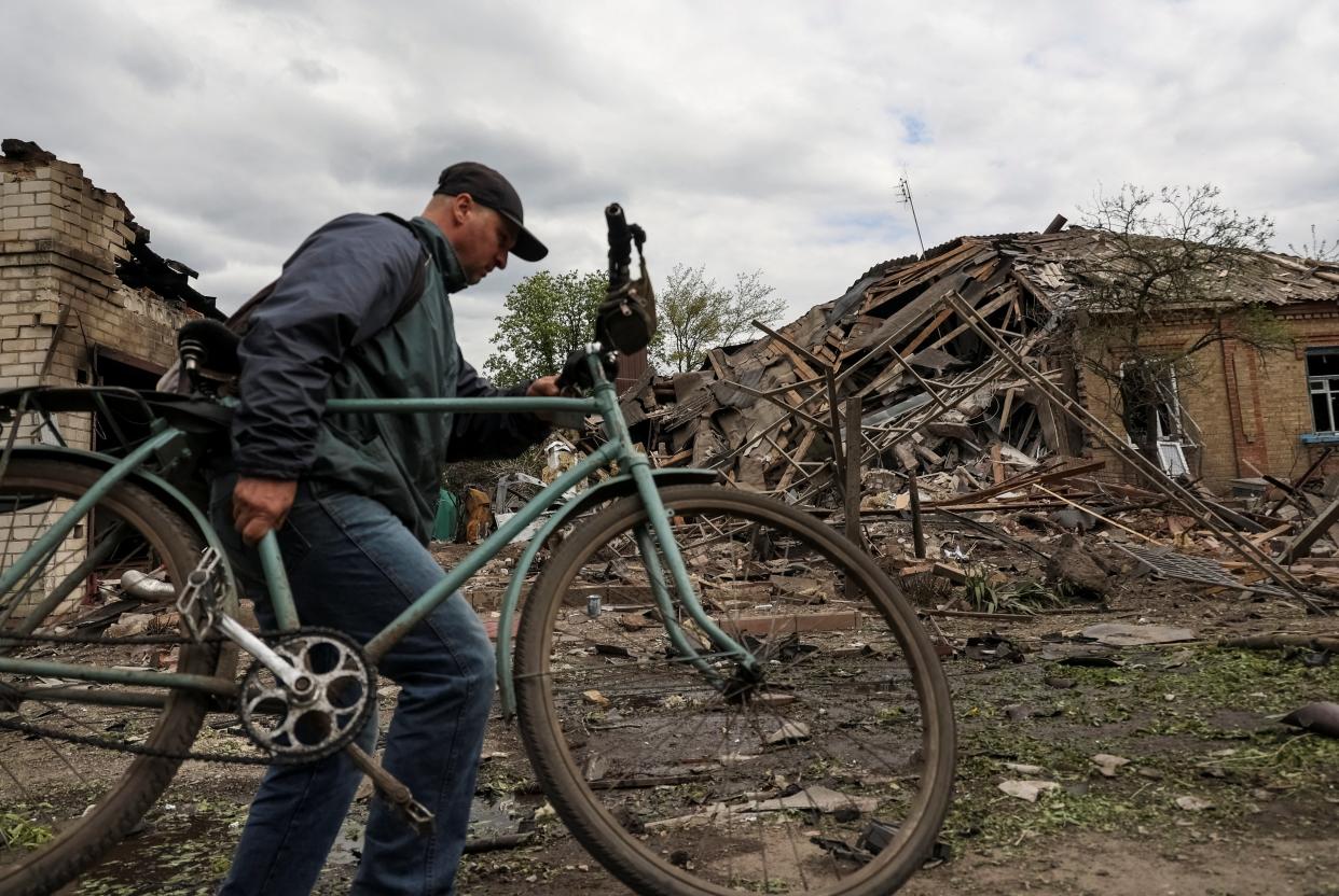 A local walks among the remains of a house hit by a Russian military strike, amid Russia's attack on Ukraine, in Sloviansk (REUTERS)