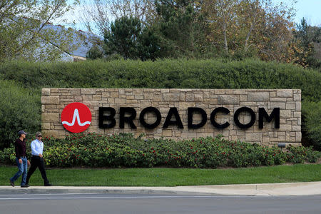 FILE PHOTO: A sign to the campus offices of chip maker Broadcom Ltd, who announced on Monday an unsolicited bid to buy peer Qualcomm Inc for $103 billion, is shown in Irvine, California, U.S., November 6, 2017. REUTERS/Mike Blake/File Photo