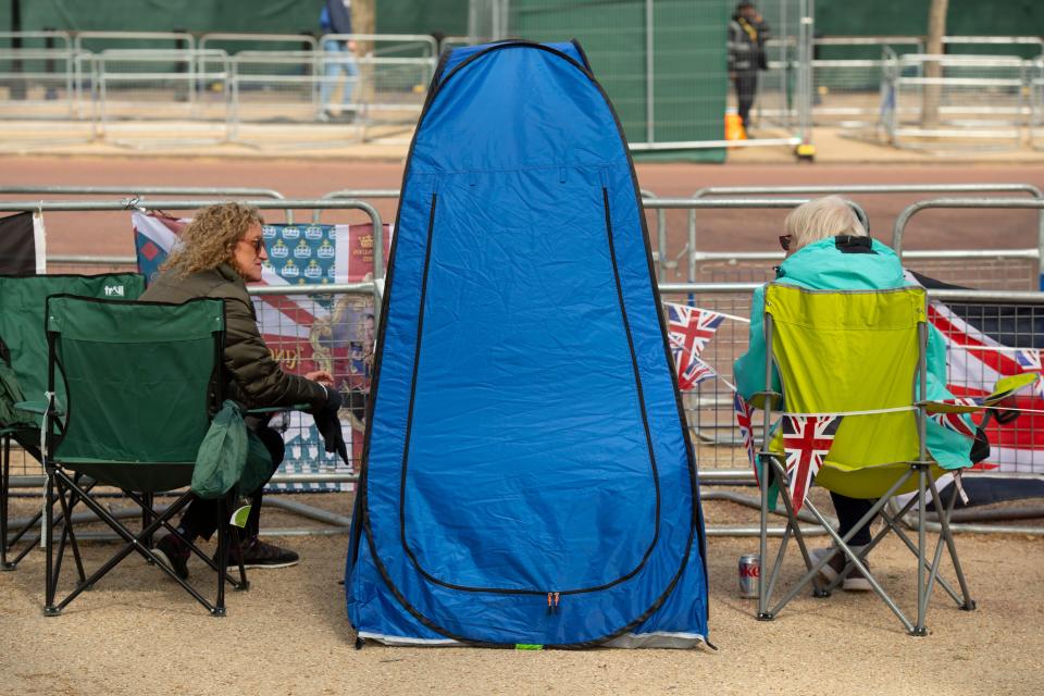 The Mall, London, UK. 4th May, 2023. Two days before the Coronation of King Charles III preparations continue on The Mall for the procession with more Royal watchers arriving to camp out over two nights in spite of heavy rain being forecast. Credit: Malcolm Park/Alamy Live News