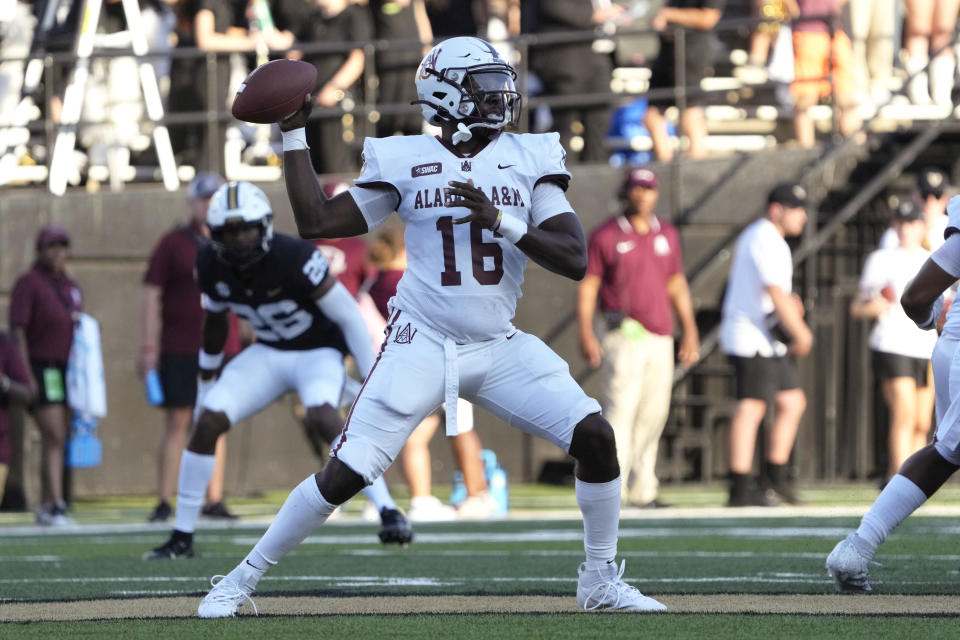 Alabama A&M quarterback Xavier Lankford looks to pass the ball in the first half of an NCAA college football game against Vanderbilt, Saturday, Sept. 2, 2023, in Nashville, Tenn. (AP Photo/Mark Humphrey)