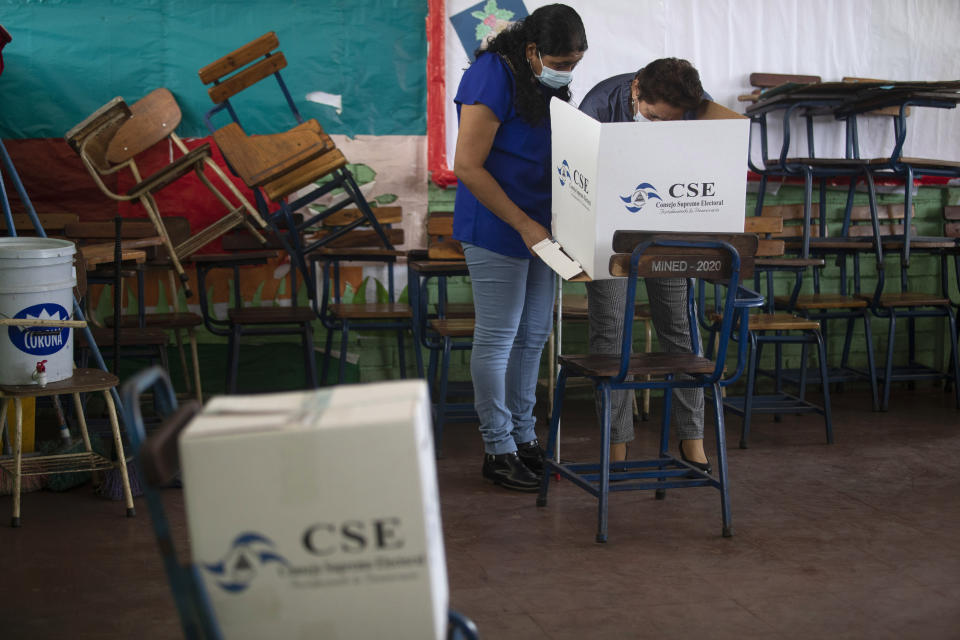 A blind women is assisted then voting in municipal elections, in Managua, Nicaragua, Sunday, Nov. 6, 2022. After the Inter-American Commission on Human Rights expressed concern that "the minimum conditions necessary" to hold free and fair elections do not exist in Nicaragua, President Daniel Ortega's Sandinista National Liberation Front is hoping to expand on the 141 of the country's 153 municipalities that it already controls. (AP Photo)