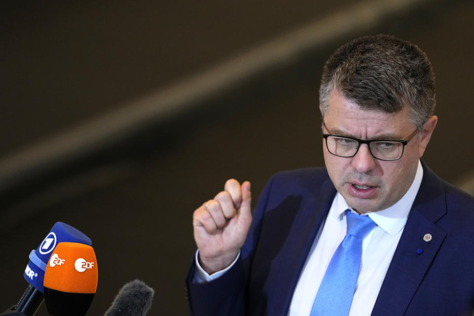 Estonia's Foreign Minister Umas Reinsalu speaks with the media as he arrives for a meeting of EU foreign ministers at the Prague Congress Center in Prague, Czech Republic, Wednesday, Aug. 31, 2022. (AP Photo/Petr David Josek)