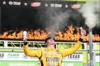Kyle Busch celebrates in Victory Lane after winning a NASCAR Xfinity Series auto race at Texas Motor Speedway in Fort Worth, Texas, Saturday, June 12, 2021. (AP Photo/Larry Papke)
