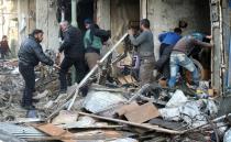 Syrians search for survivors following a suspected Russian air strike on the village of Maaret al-Numan, Idlib province, on December 4, 2016