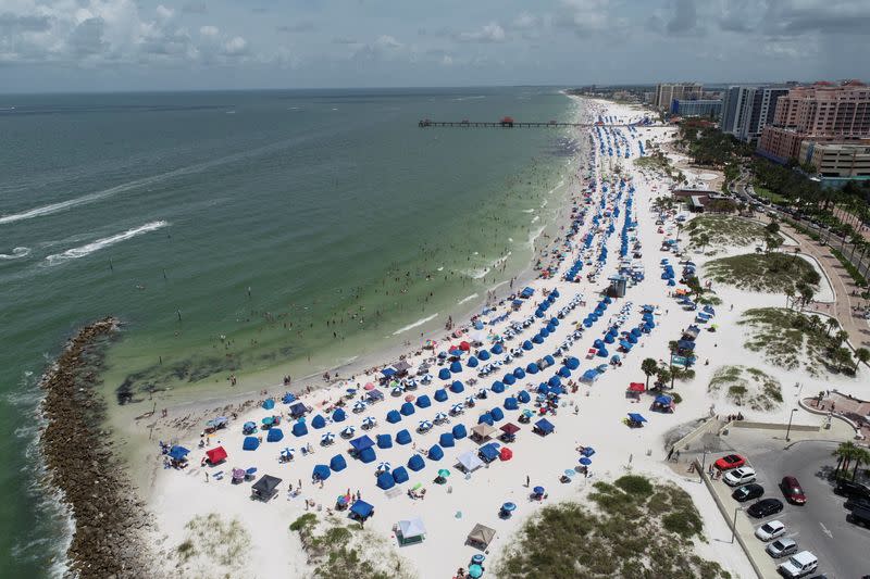 FILE PHOTO: Sun seekers gather at Clearwater Beach on Independence Day