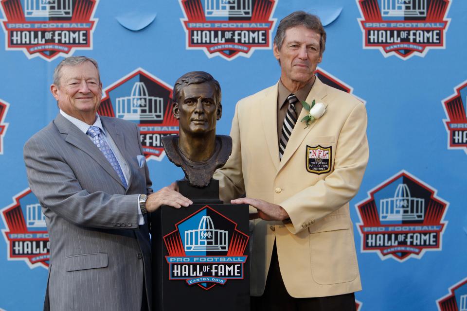 Dick LeBeau, right, poses with brother Bob LeBeau after being enshrined into the Pro Football Hall of Fame, Saturday, Aug. 7, 2010, in Canton.