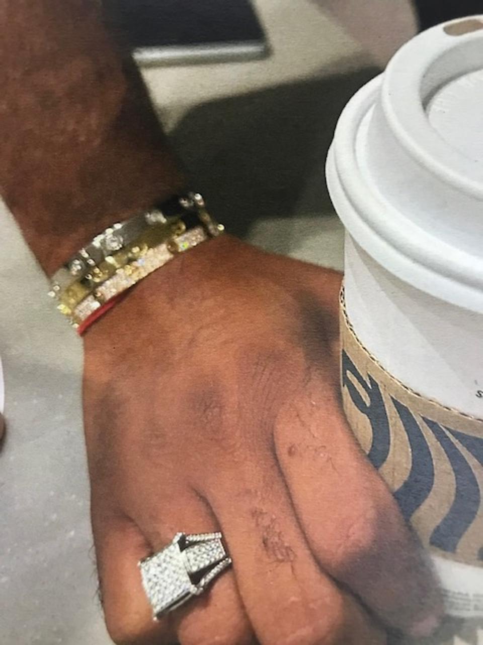 Police have released images of the distinctive jewellery Justin Henry was wearing when he disappeared (Met police)