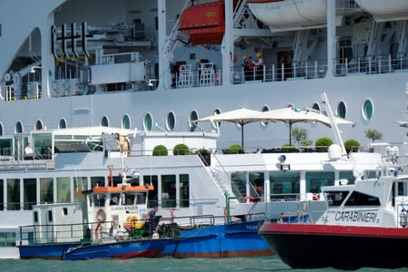 The cruise ship MSC Opera loses control and crashes against a smaller tourist boat at the San Basilio dock in Venice