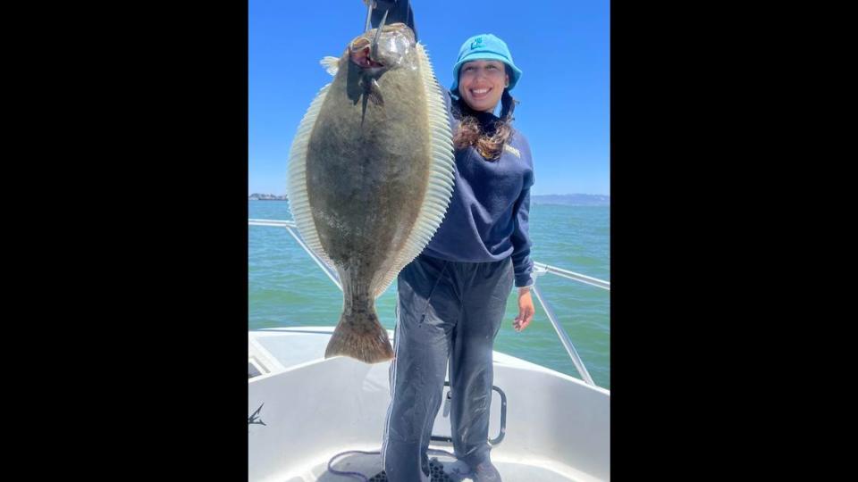 Rebecca Angelica Hernandez is all smiles after landing a quality California halibut with Captain Trent Slate out of Loch Lomond Marina recently.