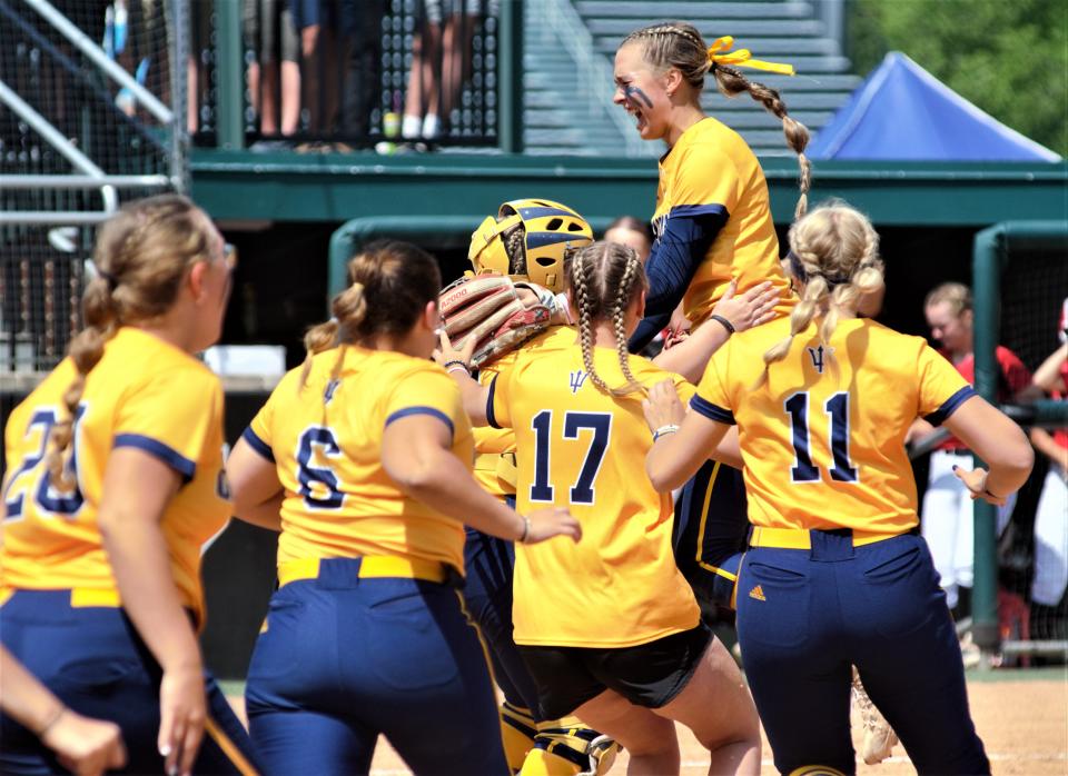 Aubrey Jones (top right) celebrates with the Gaylord team after the final out of the MHSAA Division 2 state finals on Saturday, June 17 at Secchia Stadium on the campus of Michigan State University, East Lansing, Mich.