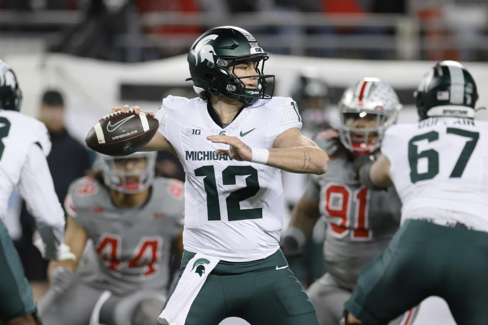 Michigan State quarterback Katin Houser looks for a receiver during the first half of the team's NCAA college football game against Ohio State on Saturday, Nov. 11, 2023, in Columbus, Ohio. (AP Photo/Jay LaPrete)