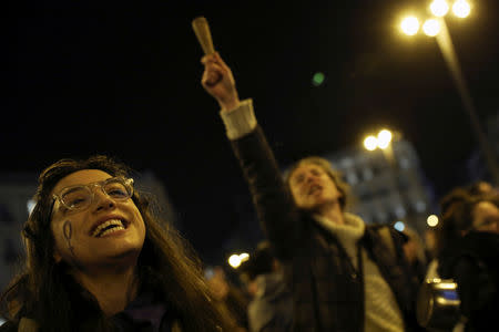 Women bang pots and pans during a protest at the start of a nationwide feminist strike on International Women's Day at Puerta del Sol Square in Madrid, Spain, late March 7, 2019.REUTERS/Susana Vera